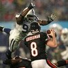 MIAMI GARDENS, FL - FEBRUARY 04:  Quaterback Rex Grossman #8 of the Chicago Bears drops back to pass as Robert Mathis #98 of the Indianapolis Colts dives in during Super Bowl XLI on February 4, 2007 at Dolphin Stadium in Miami Gardens, Florida. The Colts 