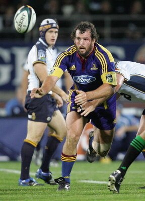 DUNEDIN, NEW ZEALAND - MAY 05:  Carl Hayman of the Highlanders off loads the ball during the round 14 Super 14 match between the Highlanders and the Brumbies at Carisbrook May 5, 2007 in Dunedin, New Zealand.  (Photo by Sandra Mu/Getty Images)