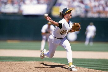 OAKLAND, CA - JULY 4:  Pitcher Dennis Eckersley #43 of the Oakland Athletics delivers against the Milwaukee Brewers during the game at the Oakland-Alameda County Coliseum on July 4, 1995 in Oakland, California.  The Athletics won 5-3.  (Photo by Jed Jacob