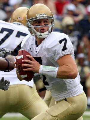 BALTIMORE - NOVEMBER 15:  Jimmy Clausen #7 of the Notre Dame Fighting Irish drops back to throw a pass against the Navy Midshipmen on November 15, 2008 at M&T Bank Stadium in Baltimore, Maryland. Notre Dame defeated Navy 27-21.  (Photo by Jim McIsaac/Gett