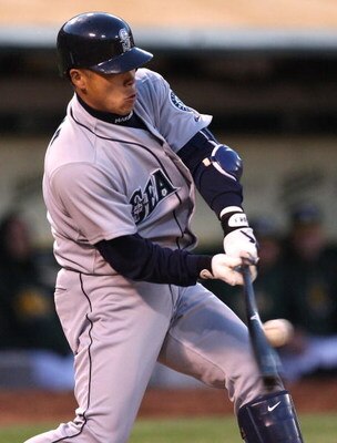 OAKLAND, CA - APRIL 10: Kenji Johjima #2 of the Seattle Mariners hits an RBI single in the fifth inning against the Oakland Athletics during Opening Day at a Major League Baseball game on April 10, 2009 at the Oakland Coliseum in Oakland, California.  (Ph