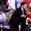 INDIANAPOLIS - MARCH 27:  Head coach Rick Pitino of the Louisville Cardinals kneels on the court as he looks on against the Arizona Wildcats during the third round of the NCAA Division I Men's Basketball Tournament at the Lucas Oil Stadium on March 27, 20