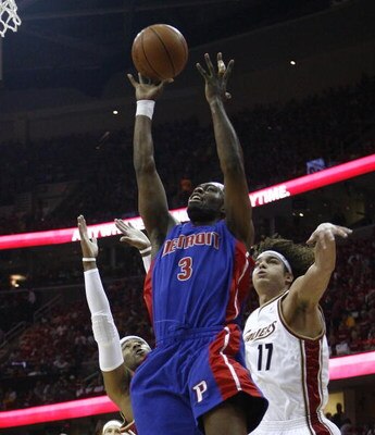 CLEVELAND - APRIL 18:   Rodney Stuckey #3 of the Detroit Pistons shoots over Mo Williams #2 and Anderson Varejao #17 of the Cleveland Cavaliers during Game One of the Eastern Conference Quarterfinals during the 2009 NBA Playoffs at Quicken Loans Arena on 