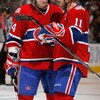 TORONTO - OCTOBER 11:  Sergei Kostitsyn #74 and Saku Koivu #11 of the Montreal Canadiens talk during the game against the Toronto Maple Leafs at the Air Canada Centre October 11, 2008 in Toronto, Ontario. (Photo By Dave Sandford/Getty Images)