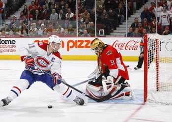 OTTAWA - NOVEMBER 20:  Saku Koivu #11 of the Montreal Canadiens is stopped in his shootout attempt by Alex Auld #31 of the Ottawa Senators during the game on November 20, 2008 at the Scotiabank Place in Ottawa, Canada.  (Photo by Phillip MacCallum/Getty I