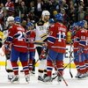MONTREAL- APRIL 22:  Alexei Kovalev #27 and Georges Laraque #17 of the Montreal Canadiens shake hands with Stephane Yelle #18 and Zdeno Chara #33 of the Boston Bruins after Game Four of the Eastern Conference Quarterfinals of the 2009 Stanley Cup Playoffs