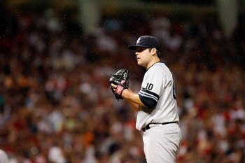 CLEVELAND - OCTOBER 05:   Joba Chamberlain #62 of the New York Yankees readies himself to pitch as gnats swarm around them against the Cleveland Indians during Game Two of the American League Divisional Series at Jacobs Field on October 5, 2007 in Clevela