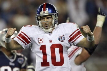 GLENDALE, AZ - FEBRUARY 03:  Quarterback Eli Manning #10 of the New York Giants reacts after he threw a 5-yard touchdown pass to David Tyree #85 in the fourth quarter against the New England Patriots during Super Bowl XLII on February 3, 2008 at the Unive