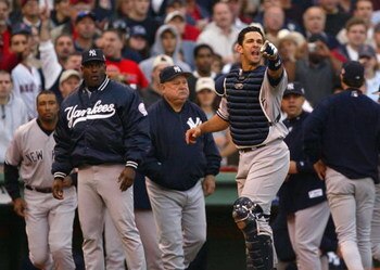 BOSTON - OCTOBER 11:  Jorge Posada #20 of the New York Yankees shouts at Pedro Martinez #45 of the Boston Red Sox after he hit a batter during Game 3 of the 2003 American League Championship Series on October 11, 2003 at Fenway Park in Boston, Massachuset