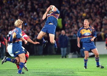 NEW ZEALAND - JULY 22:  Highlander's Jeff Wilson leaps for a high ball during the Super 12 match played at Carisbrook, Dunedin, Friday.  (Photo by Phil Walter/Getty Images)