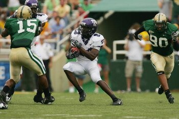 WACO, TX - SEPTEMBER 3:  Running back Aaron Brown #23 of the TCU Horned Frogs runs with the ball during the game against the Baylor Bears on September 3, 2006 at Floyd Casey Stadium in Waco, Texas. TCU defeated Baylor 17-7.  (Photo by Ronald Martinez/Gett