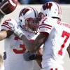 EAST LANSING, MI - NOVEMBER 01:  John Clay #32 of the Wisconsin Badgers celebrates a fourth quarter touchdown with Kyle Jefferson #7 while playing the Michigan State Spartans on November 1, 2008 at Spartan Stadium in East Lansing, Michigan. Michigan State