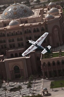 ABU DHABI, UNITED ARAB EMIRATES  - APRIL 19:  (NO SALES, EDITORIAL USE ONLY) In this handout image provided by GlobalNewsroom, Austrian World Champion pilot Hannes Arch of Team Abu Dhabi flies over the Emirates Palace Hotel after winning the first stage o
