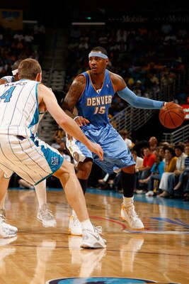 NEW ORLEANS - APRIL 27:  Carmelo Anthony #15 of the Denver Nuggets drives the ball around Sean Marks #4 of the New Orleans Hornets in Game Four of the Western Conference Quarterfinals during the 2009 NBA Playoffs at New Orleans Arena on April 27, 2009 in 