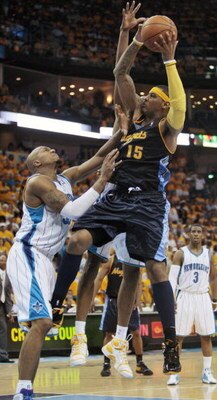 NEW ORLEANS - APRIL 25:  Carmelo Anthony #15 of the Denver Nuggets drives to the basket against David West #30 of the New Orleans Hornets during Game Three of the Western Conference Quarterfinals during the 2009 NBA Playoffs at New Orleans Arena on April 