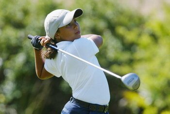 SAN DIEGO - July 17:  Cheyenne Woods, niece of Tiger Woods, tees off the 10th hole during the 2nd Round of the Junior World Golf Championships on July 17, 2002 at the Lawrence Welk Resort in San Diego, California.  (Photo by Dolanld Miralle/Getty Images)