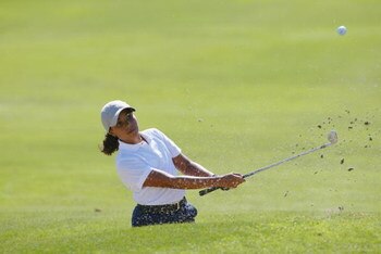SAN DIEGO - July 17:  Cheyenne Woods, niece of Tiger Woods, hits out of the bunker on the 9th hole during the 2nd Round of the Junior World Golf Championships on July 17, 2002 at the Lawrence Welk Resort in San Diego, California.  (Photo by Dolanld Mirall