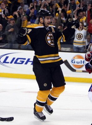 BOSTON - APRIL 18:  Patrice Bergeron #37 of the Boston Bruins celebrates teammate Chuck Kobasew's goal against the Montreal Canadiens during Game Two of the Eastern Conference Quarterfinals of the 2009 Stanley Cup playoffs on April 18, 2009 at the TD Bank