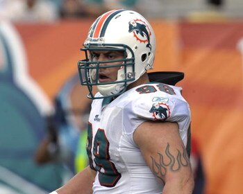 MIAMI, FL - JANUARY 4:  Linebacker Matt Roth #98 of the Miami Dolphins sets on defense against the Baltimore Ravens in an NFL Wildcard Playoff Game at Dolphins Stadium on January 4, 2009 in Miami, Florida.  (Photo by Al Messerschmidt/Getty Images) 