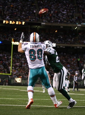 EAST RUTHERFORD, NJ - DECEMBER 28: Anthony Fasano #80 of The Miami Dolphins scores a touchdown against Abram Elam #27 of the New York Jets during their game on December 28, 2008 at Giants Stadium in East Rutherford, New Jersey. (Photo by Al Bello/Getty Im