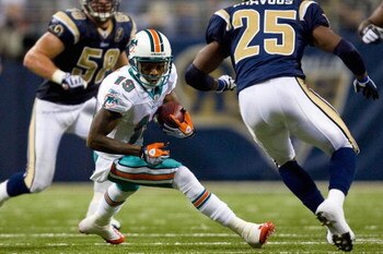ST. LOUIS, MO. - NOVEMBER 30:  Ted Ginn Jr. #19 of the Miami Dolphins runs up field against the St. Louis Rams at the Edward Jones Dome on November 30, 2008 in St. Louis, Missouri.  The Dolphins beat the Rams 16-12.  (Photo by Dilip Vishwanat/Getty Images