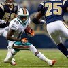 ST. LOUIS, MO. - NOVEMBER 30:  Ted Ginn Jr. #19 of the Miami Dolphins runs up field against the St. Louis Rams at the Edward Jones Dome on November 30, 2008 in St. Louis, Missouri.  The Dolphins beat the Rams 16-12.  (Photo by Dilip Vishwanat/Getty Images