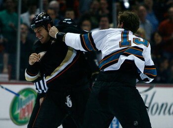 ANAHEIM, CA - APRIL 27:  (R-L) Center Joe Thornton #19 of the San Jose Sharks fights with center Ryan Getzlaf #15 of the Anaheim Ducks at the beginning of Game Six of the Western Conference Quarterfinal Round of the 2009 Stanley Cup Playoffs at the Honda 