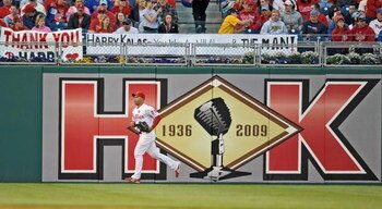 PHILADELPHIA - APRIL 17: Raul Ibanez #29 of the Philadelphia Phillies runs past a sign dedicated to recently departed Philadelphia Phillies announcer Harry Kalas during the game against the San Diego Padres on April 17, 2009 at Citizens Bank Park in Phila