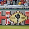 PHILADELPHIA - APRIL 17: Raul Ibanez #29 of the Philadelphia Phillies runs past a sign dedicated to recently departed Philadelphia Phillies announcer Harry Kalas during the game against the San Diego Padres on April 17, 2009 at Citizens Bank Park in Phila