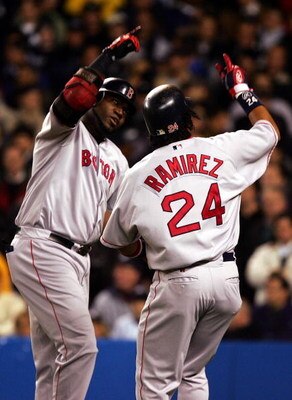NEW YORK - OCTOBER 20:  David Ortiz #34 of the Boston Red Sox celebrates with teammate Manny Ramirez #24 after hitting a two-run home run in the first inning against the New York Yankees during game seven of the American League Championship Series on Octo