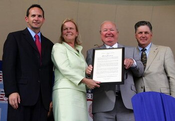 COOPERSTOWN, NY - JULY 27:  Dave Niehaus (2nd R) accepts Ford C. Frick award from (L-R) National Baseball Hall of Fame President Jeff Idelson, Hall of Fame chairman Jane Forbes Clark, and Hall of famer Tom Seaver at Clark Sports Center during the Baseball