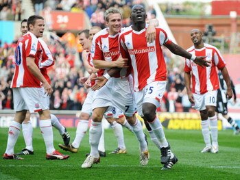 STOKE, UNITED KINGDOM - APRIL 11:  Abdoulaye Faye of Stoke City celebrates with Liam Lawrence as he scores their first goal during the Barclays Premier League match between Stoke City and Newcastle United at the Britannia Stadium on April 11, 2009 in Stok