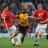 MANCHESTER, ENGLAND - APRIL 29:  Abou Diaby of Arsenal battles for the ball with Darren Fletcher of Manchester United during the UEFA Champions League Semi Final First Leg match between Manchester United and Arsenal at Old Trafford on April 29, 2009 in Ma