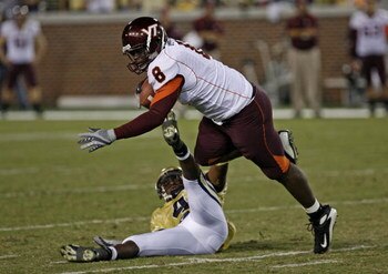 ATLANTA - NOVEMBER 1: Safety Jamal Lewis #4 of the Georgia Tech Yellow Jackets tackles tight end Greg Boone #8 of the Virginia Tech Hokies November 1, 2007 at Bobby Dodd Stadium at Historic Grant Field in Atlanta, Georgia.  (Photo by Mike Zarrilli/Getty I