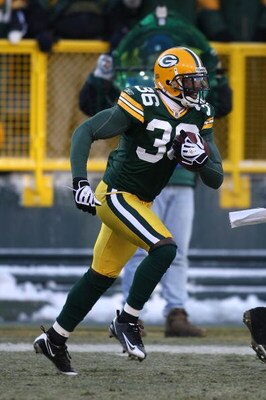 GREEN BAY, WI - DECEMBER 28: Nick Collins #36 of the Green Bay Packers runs with the ball after making an interception against the Detroit Lions on December 28, 2008 at Lambeau Field in Green Bay, Wisconsin. The Packers defeated the Lions 31-21. (Photo by