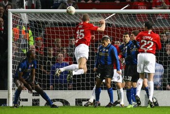 MANCHESTER, UNITED KINGDOM - MARCH 11:  Nemanja Vidic of Manchester United scores the opening goal during the UEFA Champions League Round of Sixteen, Second Leg match between Manchester United and Inter Milan at Old Trafford on March 11, 2009 in Mancheste