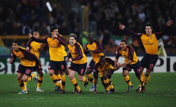 ROME - MARCH 11:  Arsenal players celebrate victory after winning on penalties during the UEFA Champions League, Round of Last 16, Second Leg match between AS Roma and Arsenal at the Stadio Olimpico on March 11, 2009 in Rome, Italy.  (Photo by Shaun Botte