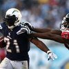 SAN DIEGO, CA - NOVEMBER 30:   Running back LaDainian Tomlinson #21 of the San Diego Chargers runs against the tackle of Chevis Jackson #22 of the Atlanta Falcons during their NFL Game on November 30, 2008 at Qualcomm Stadium in San Diego, California.  (P