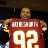 ASHBURN, VA - FEBRUARY 27:  Albert Haynesworth posese with his new jersey at a press conference after signing a 7-year contract worth approximately $100 million with the Washington Redskins on February 27, 2009 at Redskins Park in Ashburn, Virginia.  (Pho