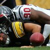 PITTSBURGH - SEPTEMBER 07:  Quarterback Ben Roethlisberger #17 of the Pittsburgh Steelers fumbles the ball while sacked by Mario Williams #90 of the Houston Texans on September 7, 2008 at Heinz Field in Pittsburgh, Pennsylvania.  (Photo by Ronald Martinez