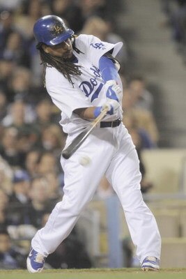 LOS ANGELES, CA - APRIL 15:  Manny Ramirez #99 of the Los Angeles Dodgers bats with his long hair against the San Francisco Giants on April 15, 2009 at Dodger Stadium in Los Angeles, California.  All Major League Baseball players wore #42 in honor of Jack