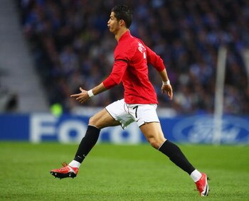 PORTO, PORTUGAL - APRIL 15:  Cristiano Ronaldo of Manchester United celebrates as he scores their first goal during the UEFA Champions League Quarter Final second leg match between FC Porto and Manchester United at the Estadio do Dragao on April 15, 2009 