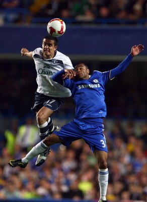 LONDON, ENGLAND - APRIL 22: Tim Cahill of Everton heads the ball next to Ashley Cole of Chelseaduring the Barclays Premier League match between Chelsea and Everton at Stamford Bridge on April 22, 2009 in London, England.  (Photo by Phil Cole/Getty Images)