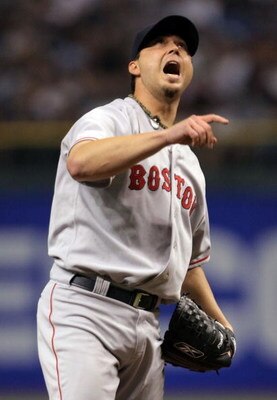 ST. PETERSBURG, FL - OCTOBER 11:  Starting pitcher Josh Beckett #19 of the Boston Red Sox reacts to a pop fly in game two of the American League Championship Series against the Tampa Bay Rays during the 2008 MLB playoffs at Tropicana Field on October 11, 
