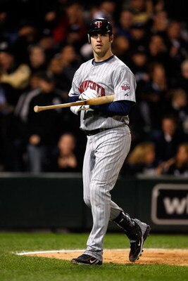 CHICAGO - SEPTEMBER 30:  Joe Mauer #7 of the Minnesota Twins walks back to the dugout after he struck out in the top of the fourth inning against the Chicago White Sox during the American League Central Division Tiebreaker game at U.S. Cellular Field on S
