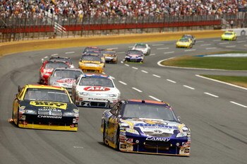 CONCORD, NC - MAY 25: David Reutimann, driver of the #00 Aaron's Dream Machine Toyota, leads a group of cars during the NASCAR Sprint Cup Series Coca-Cola 600 on May 25, 2009 at Lowe's Motor Speedway in Concord, North Carolina. (Photo by Streeter Lecka/