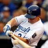 KANSAS CITY, MO - MAY 05:  Mark Teahen #24 of the Kansas City Royals connects during the first inning against the Chicago White Sox on May 5, 2009 at Kauffman Stadium in Kansas City, Missouri.  (Photo by Jamie Squire/Getty Images)