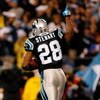 CHARLOTTE, NC - JANUARY 10:  Running back Jonathan Stewart #28 of the Carolina Panthers celebrates scoring a the first touchdown in the first quarter against the Arizona Cardinals during the NFC Divisional Playoff Game on January 10, 2009 at Bank of Ameri