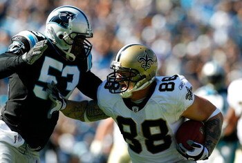 CHARLOTTE, NC - OCTOBER 19:  Na'il Diggs #53 of the Carolina Panthers tackles Jeremy Shockey #88 of the New Orleans Saints during the game at Bank of America Stadium on October 19, 2008 in Charlotte, North Carolina.  (Photo by Kevin C. Cox/Getty Images)