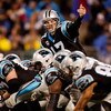 CHARLOTTE, NC - JANUARY 10:  Quarterback Jake Delhomme #17 of the Carolina Panthers signals to a teammate while lined up against the Arizona Cardinals defense during the NFC Divisional Playoff Game on January 10, 2009 at Bank of America Stadium in Charlot